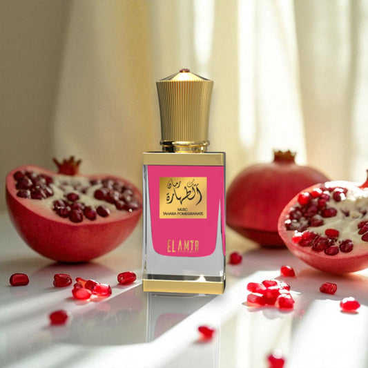 El Amir Musk Tahara Granatapfel Parfümöl 12 ml vor aufgeschnittenem Granatapfel – edles Flakon mit Goldverschluss